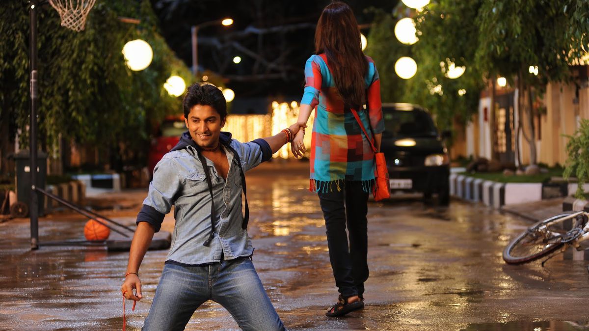 Nani slides on his knees on a wet street while holding Samantha’s hand in Eega.