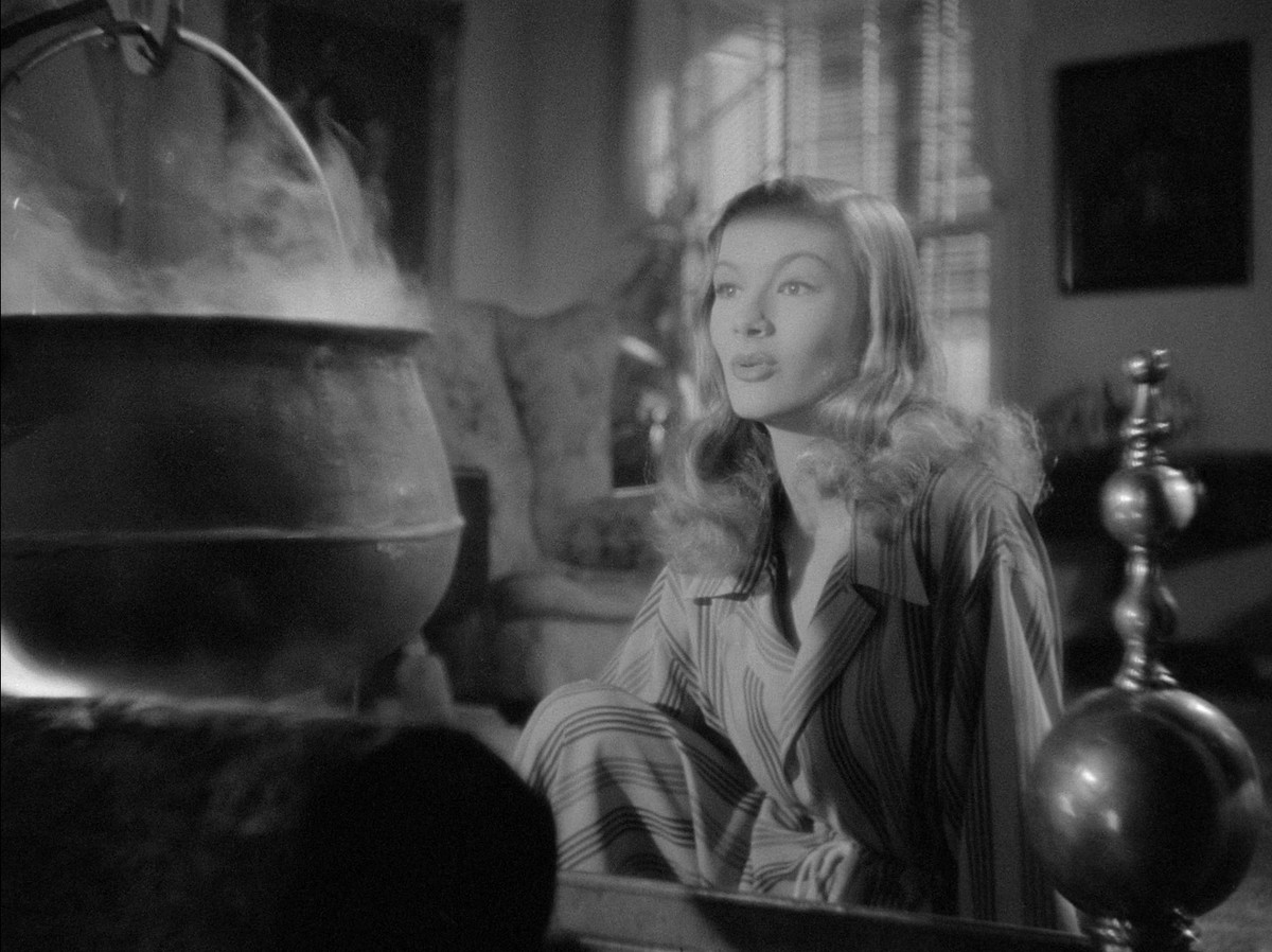 Veronica Lake sits near a cauldron in I Married A Witch
