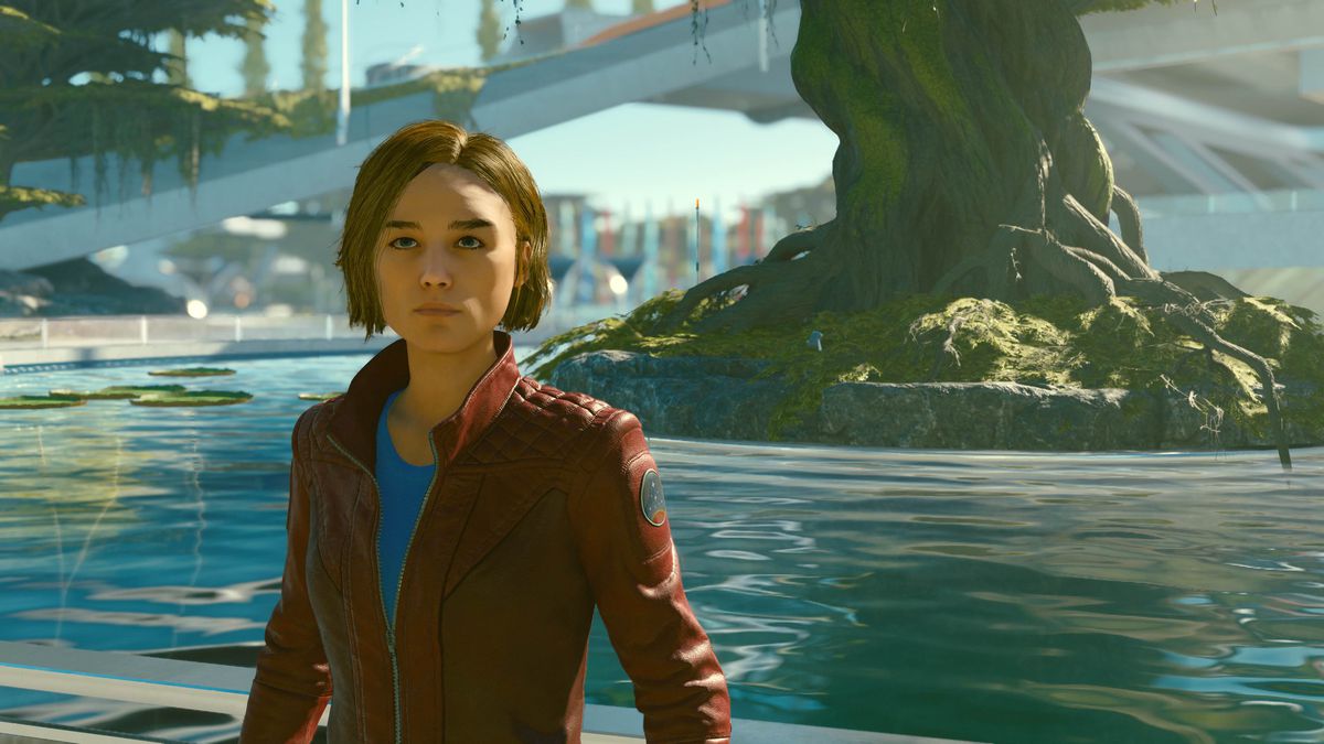 En klon av Sarah Morgan står framför en sjö i New Atlantis utan att ha hjälm på sig i Starfield.