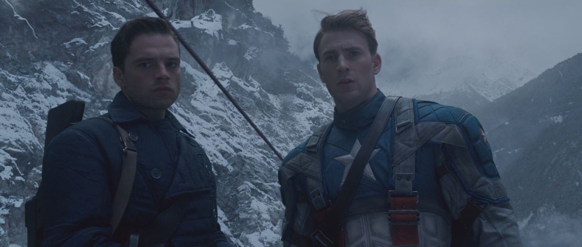 bucky and captain america stand on a snow covered mountain in captain america the first avenger