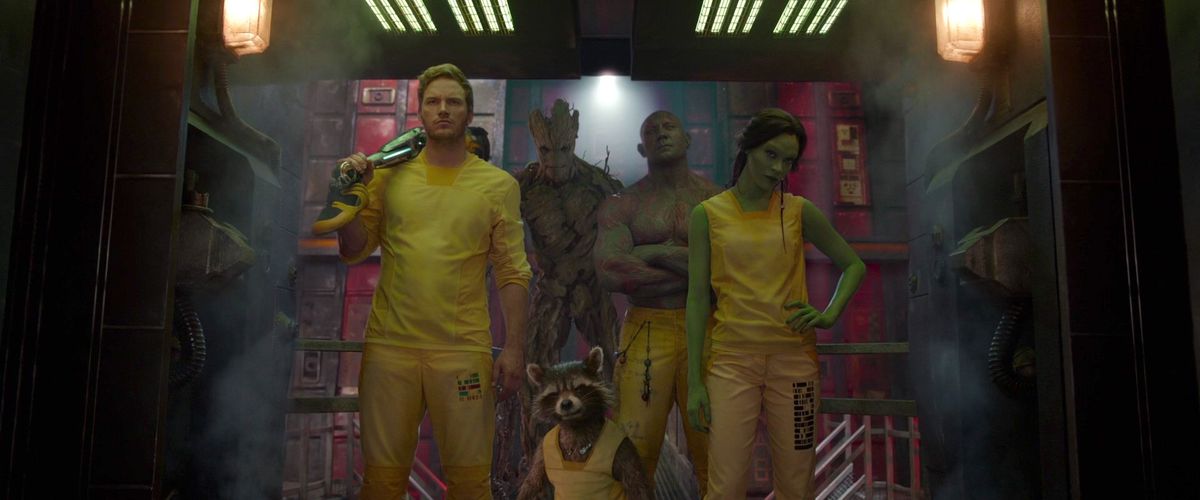 the cast of guardians of the galaxy in yellow prison jump suits