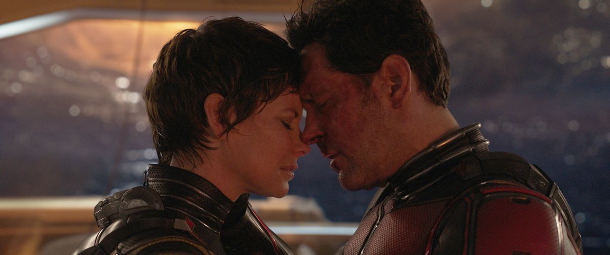 Paul Rudd and Evangeline Lilly touch foreheads in their costumes in Ant-Man and the Wasp: Quantumania.