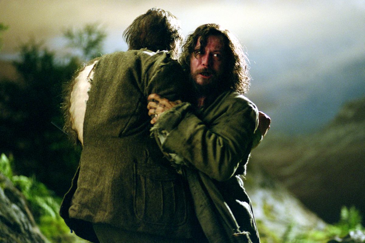 Sirius Black holds Remus Lupin as he begins to transform into a werewolf in Harry Potter and the Prisoner of Azkaban.