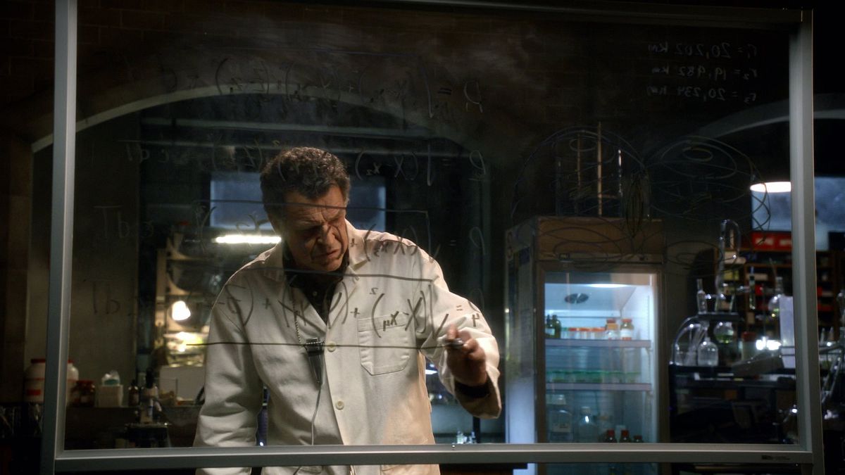 the scientist from fringe working on a math equation on a board