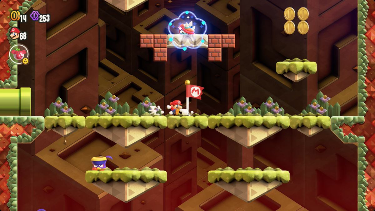 Super Mario Bros. Wonder The Midway Trial: Hop to It-skärmdump som visar Wonder Flower-platsen.