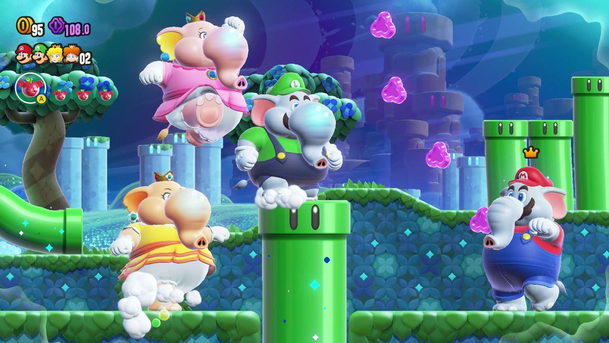 Daisy, Peach, Luigi och Mario, i elefantform, springer genom en rörfylld nivå i Super Mario Bros. Wonder