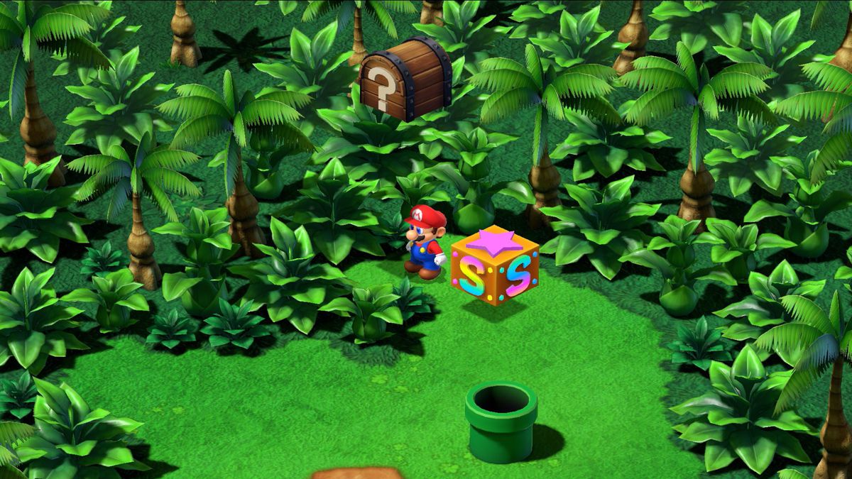 Mario stands next to a save block on Yo’ster Isle in Super Mario RPG.