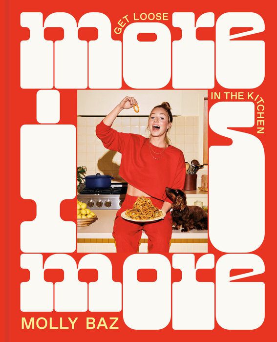 Cover image for Molly Baz’s More Is More: Get Loose in the Kitchen: A Cookbook. A red and white cover with the author holding a plate of food in the center.