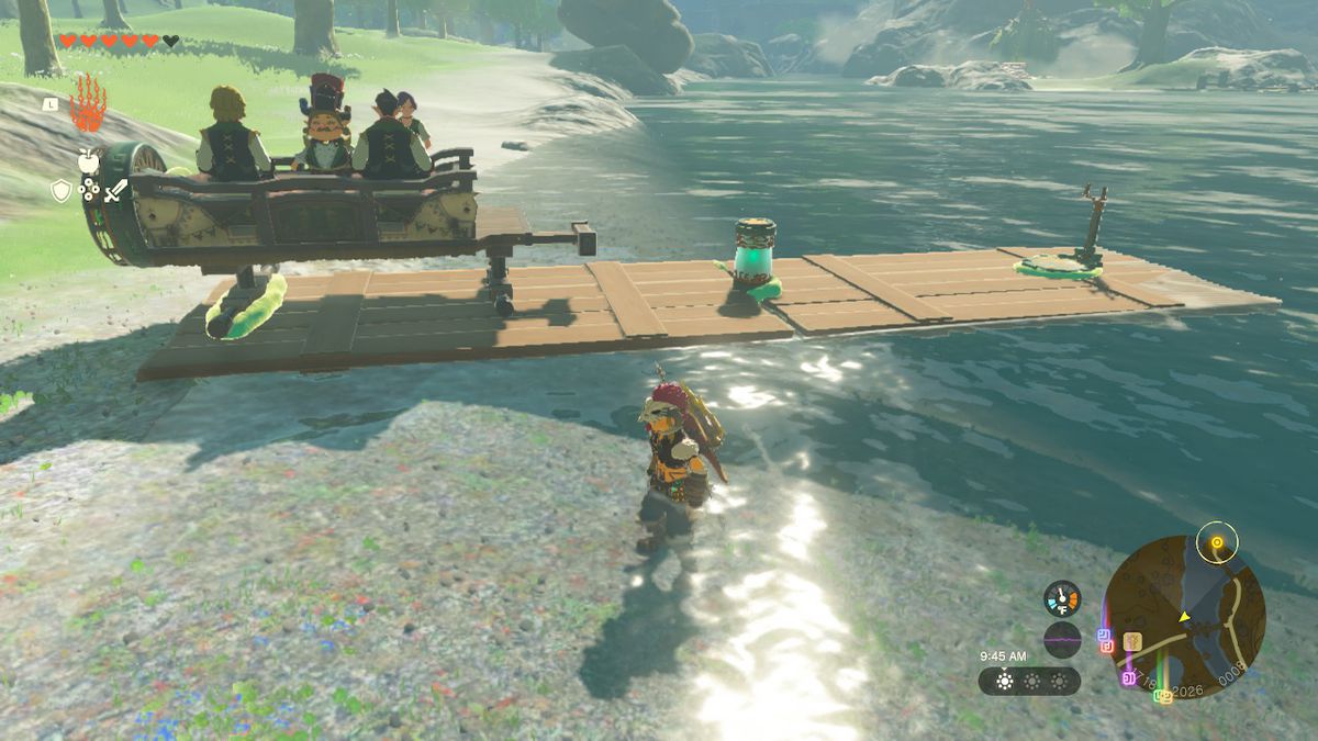 Link stands next to the improvised boat carrying the musical troupe’s wagon in Zelda: Tears of the Kingdom