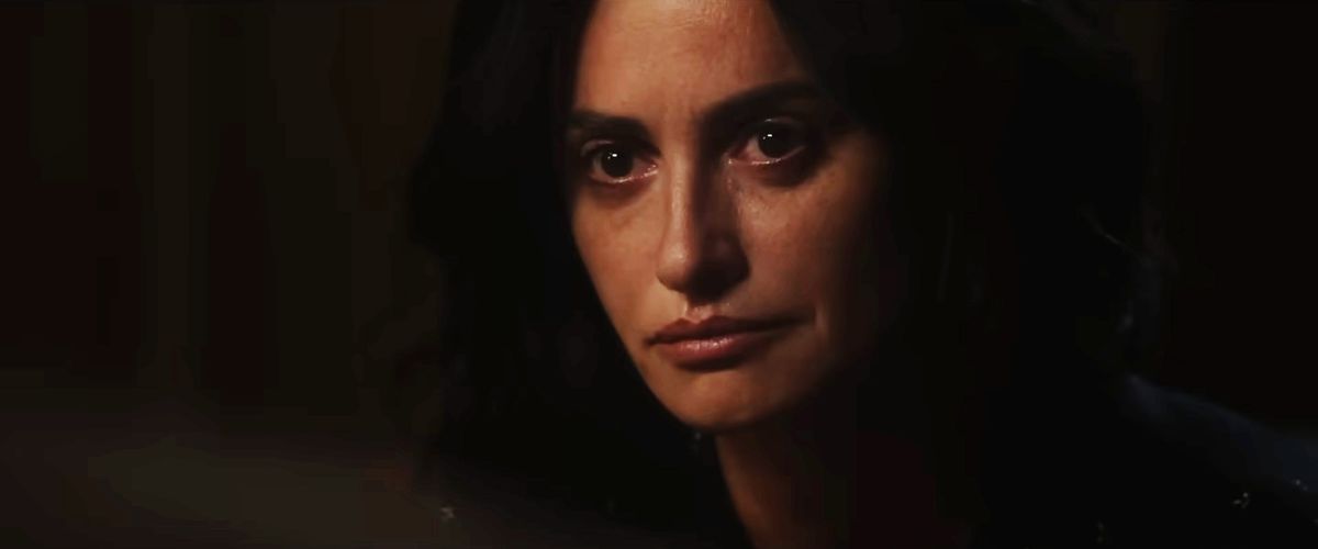 Laura Ferrari (Penélope Cruz) in closeup in a dark room with nothing showing but blackness in Ferrari