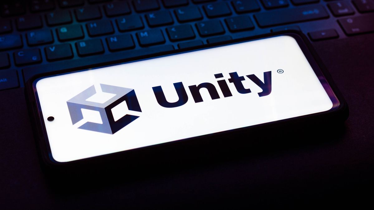 I den här fotoillustrationen ses Unity Technologies-logotypen på ett tangentbord för en bärbar dator