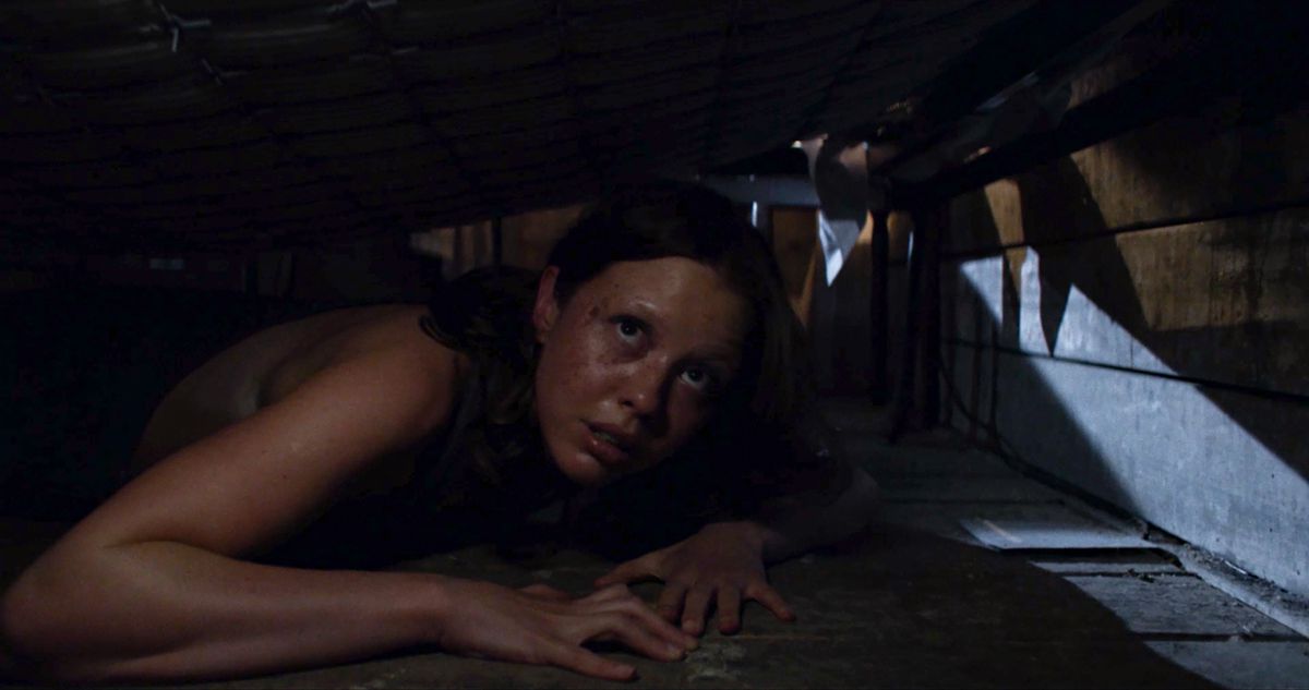 Mia Goth hides under the floorboards in Ti West’s X