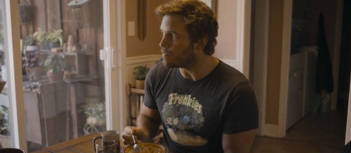 Peter Quill/Star-Lord (Chris Pratt) eats breakfast cereal at his grandfather’s kitchen table in a scene from Guardians of the Galaxy Vol. 3