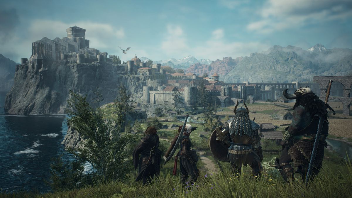 En kvartett äventyrare tittar på den avlägsna medeltida staden Vernworth i en skärmdump från Dragon's Dogma 2