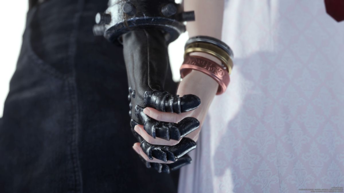 A close-up on Cloud and Aerith’s clasped hands, with Cloud’s hand in a black leather glove, and Aerith’s wrist bedecked in three metal bracelets