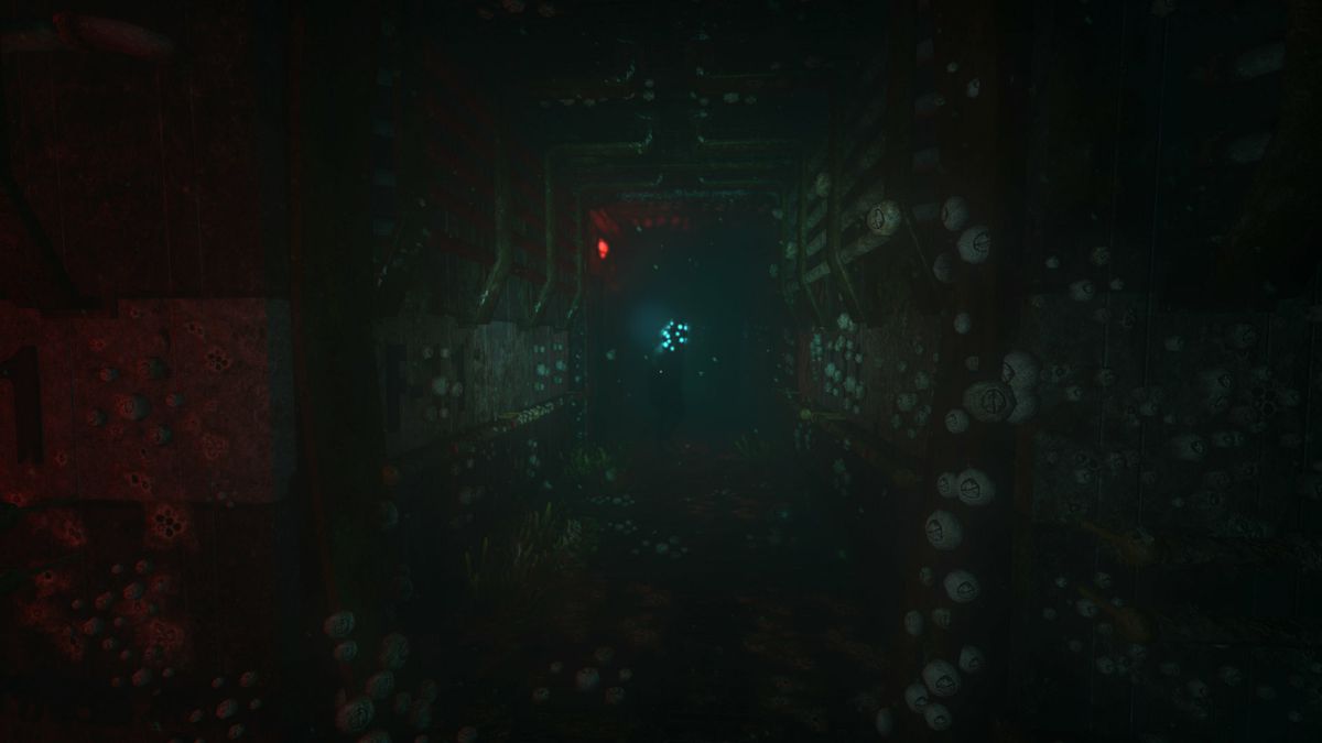 A threatening creature with a glowing, bulbous head standing at the far end of an underwater hallway.