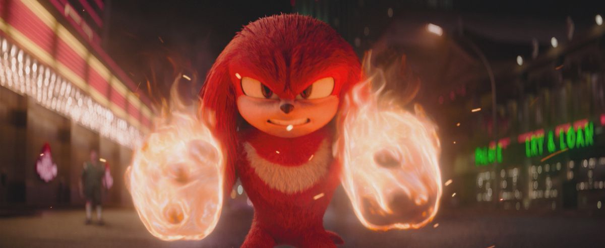 Knuckles fires up his fists while standing in a street in the Knuckles show