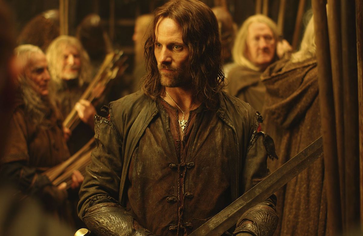 Aragorn (Mortensen) surrounded by men of Rohan.