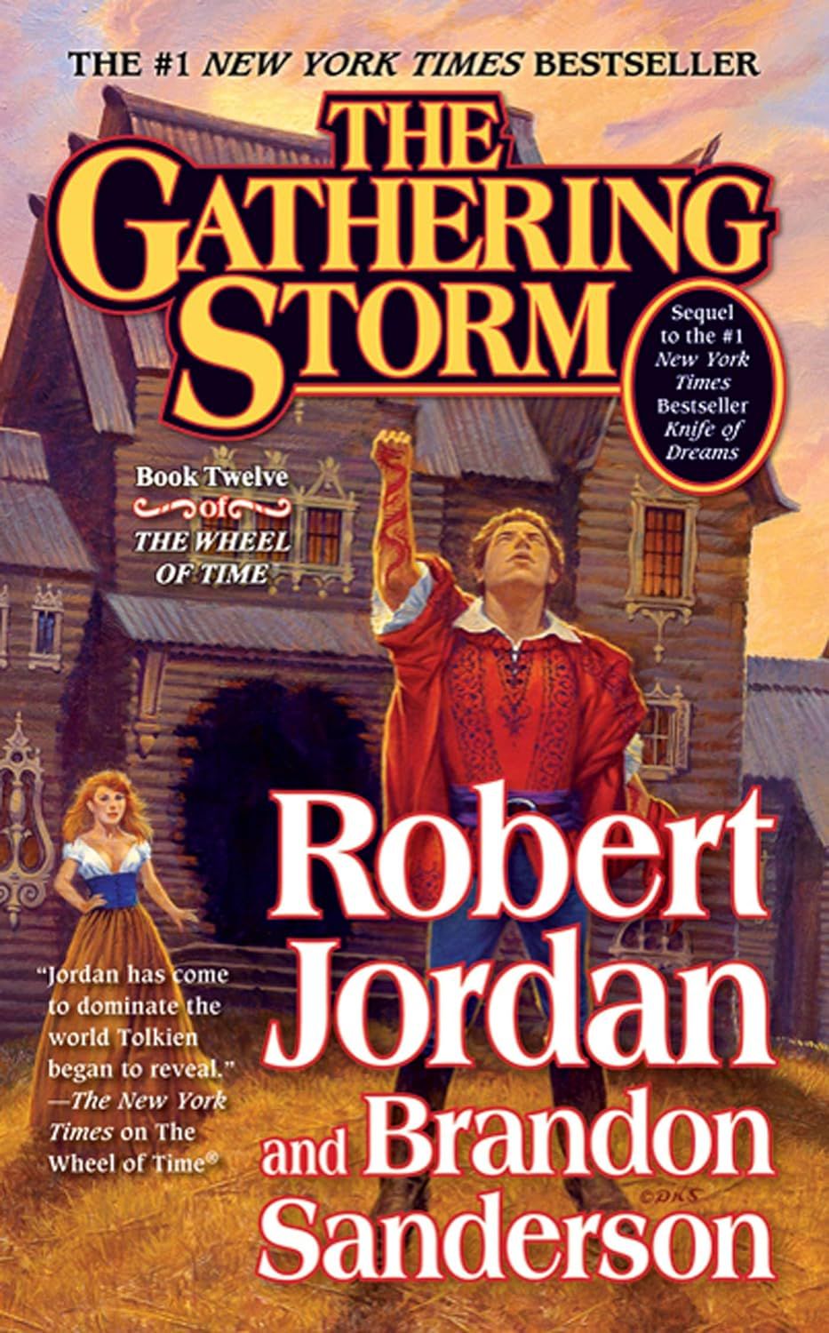 A man stands outside a house in a fantasy setting with his fist in the air on the book cover for The Gathering Storm.