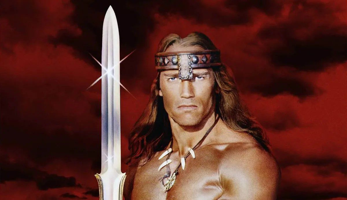 Arnold Schwarzenegger använder ett stort svärd på affischen för Conan the Barbarian.