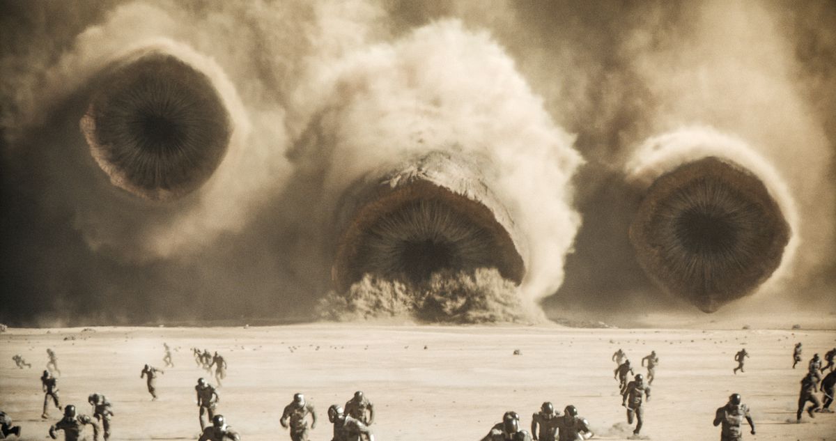 A trio of sandworms crash through the shield wall in Dune: Part 2.