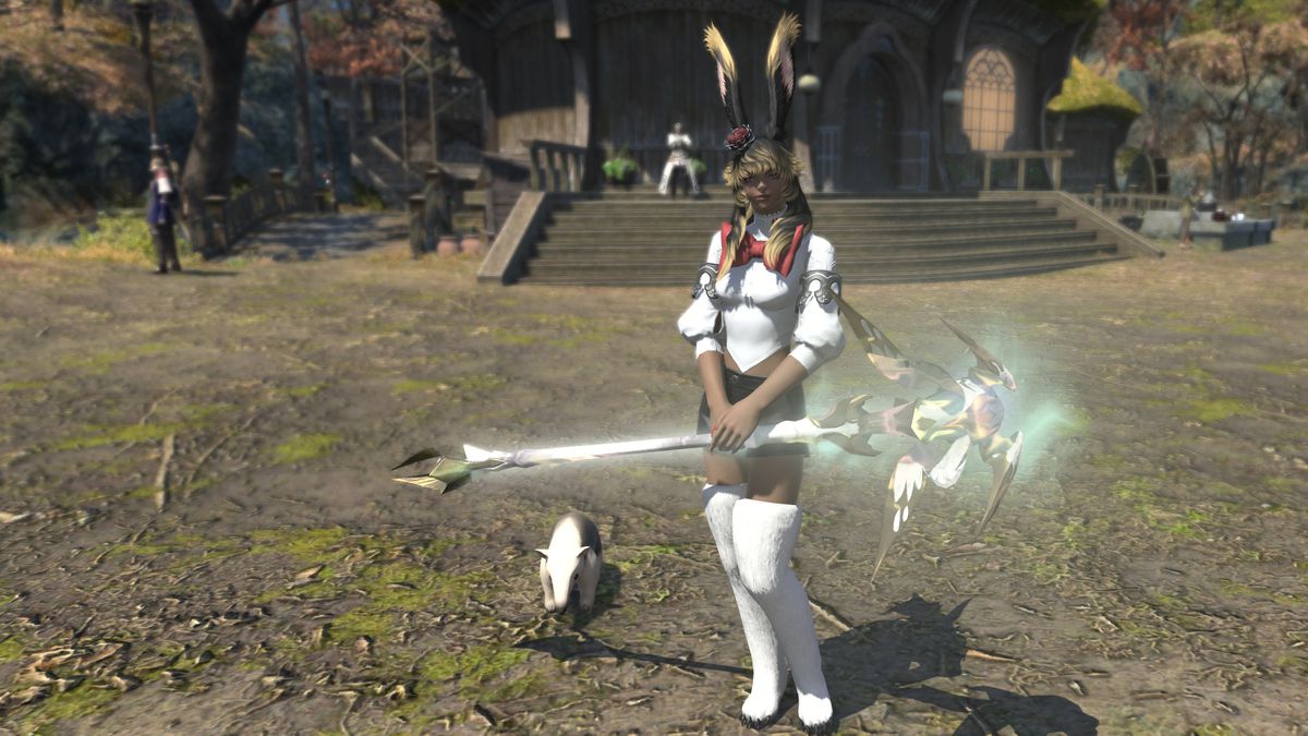 A FFXIV Viera politely holds a staff with a faint glow to it in front of her.