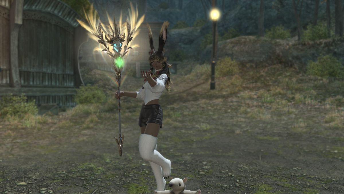 A FFXIV Viera stands holding a staff with glowing leafy branches