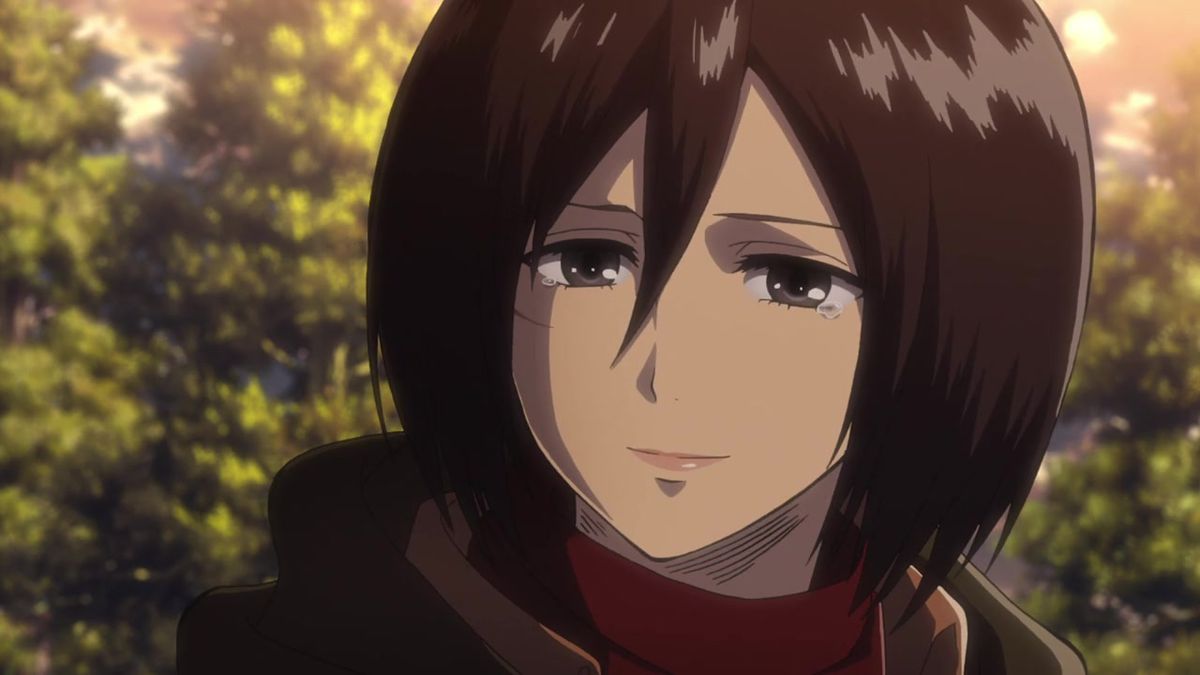 En mörkhårig animekvinna ler med tårar i ögonen och en vinröd scarf draperad runt hennes hals.