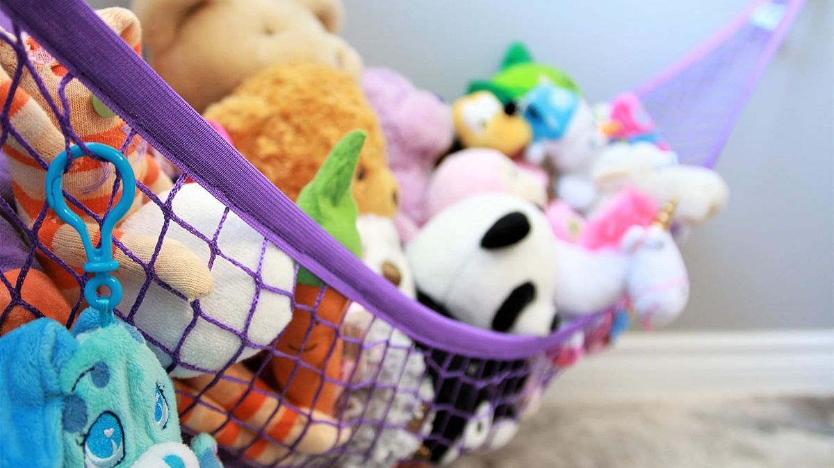 A stock photo of a plushie hammock filled with stuffed animals