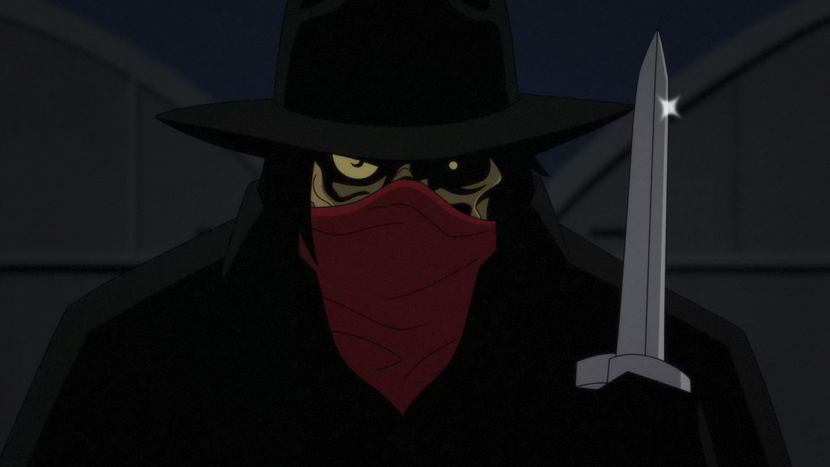 En mystisk man, möjligen Clayface, vars groteska ansikte döljs av en hatt och en bandana, håller upp en kniv i en bild från den animerade serien Batman: Caped Crusader