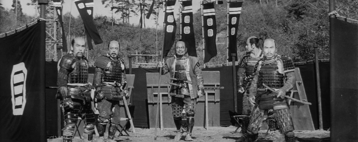 Five armor-clad samurai hold their swords in The Hidden Fortress