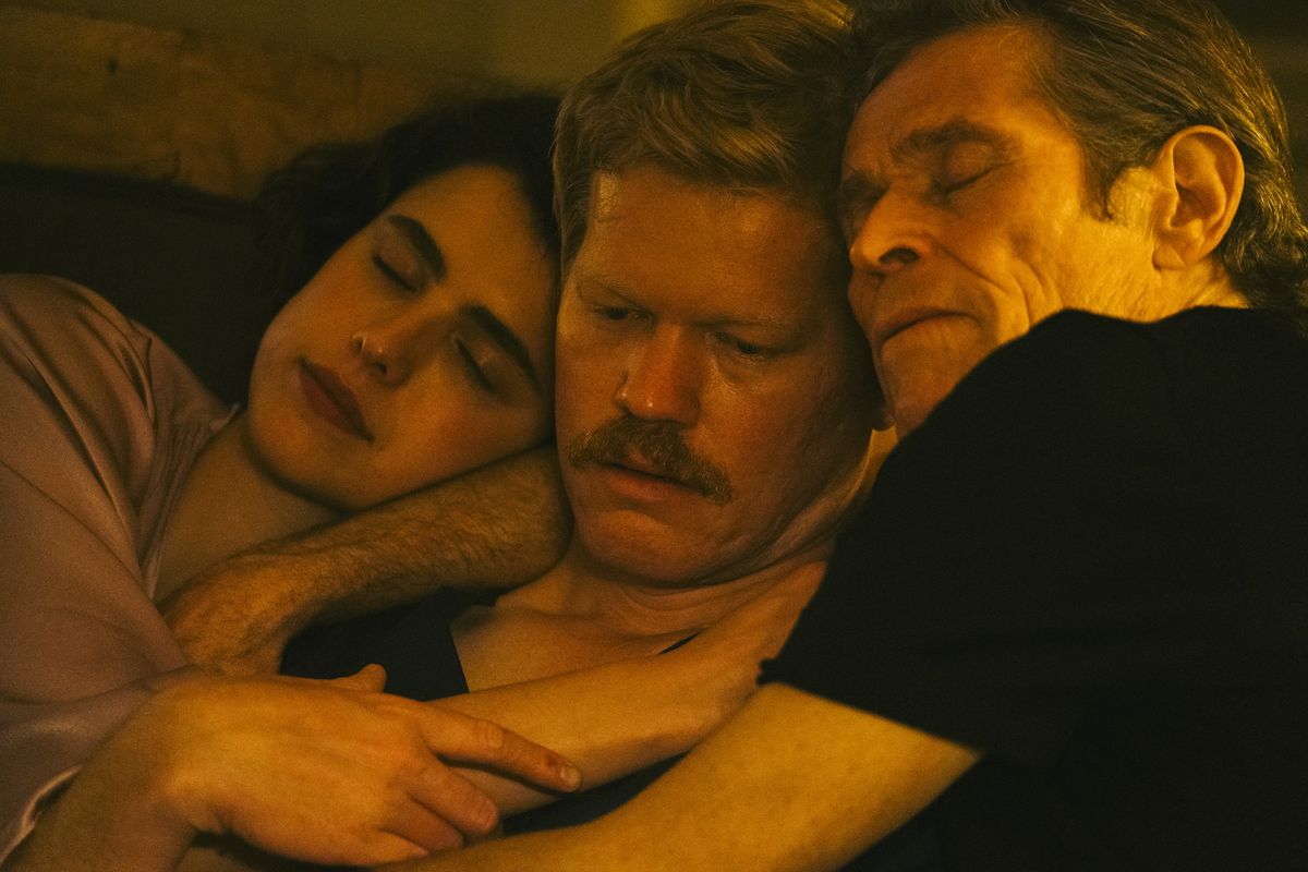 Margaret Qualley, Jesse Plemons and Willem Dafoe lie in a tender embrace in Kinds of Kindness (although Plemons looks kind of worried about it).