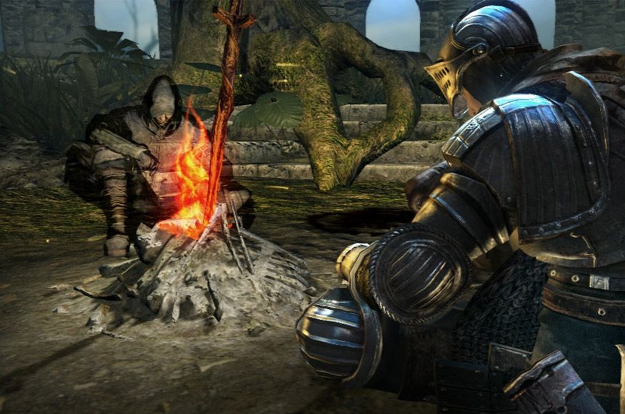 Characters sit around a campfire in Dark Souls