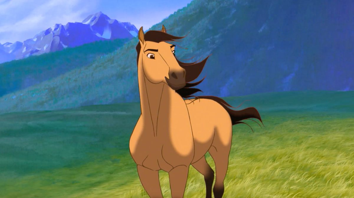 An animated horse idling in a verdant green field of grace with mountains in the distance in Spirit: Stallion of the Cimarron.