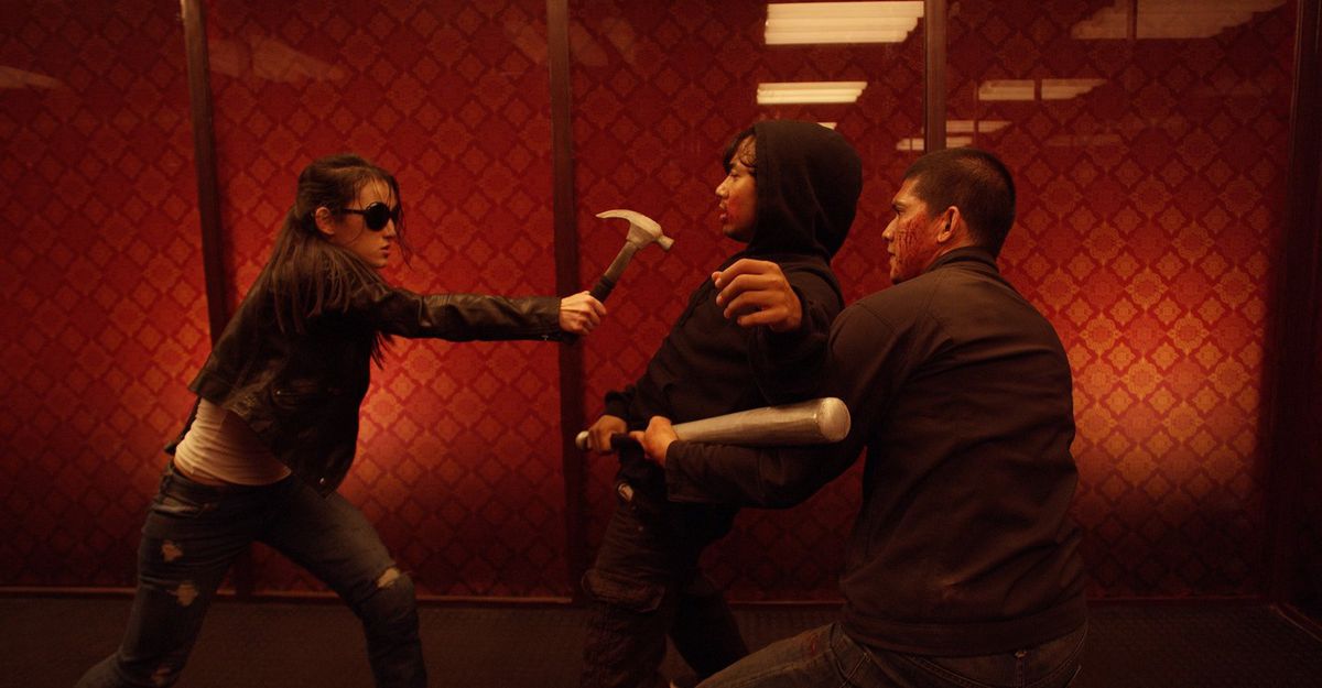 The Hammer girl swings her hammer in The Raid 2