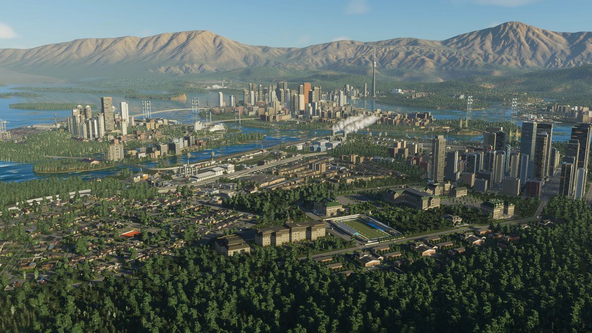 En skärmdump från Cities: Skylines 2 som visar en fullbyggd stad med skyskrapor och böljande kullar i fjärran